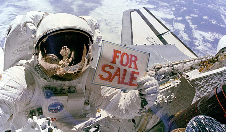 Astronaut stood on top of the recovered satellite with a 'For Sale' sign